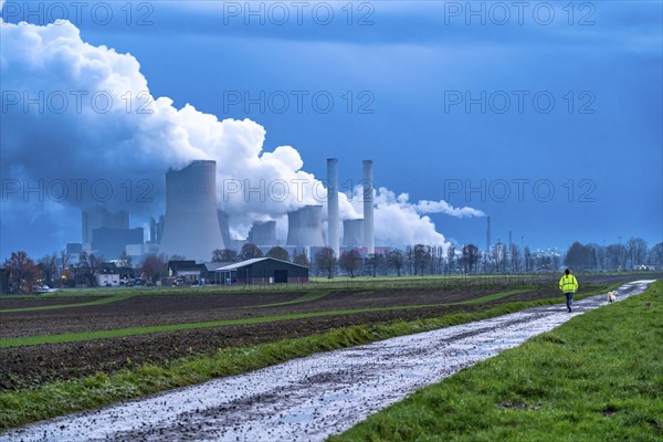 Field path, woman walking her dog, lignite-fired power plant, RWE Power AG NiederauÃŸem power
