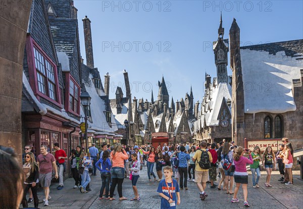 Park guests pose for photographs in The Wizarding World of Harry Potter at Universal Studios,