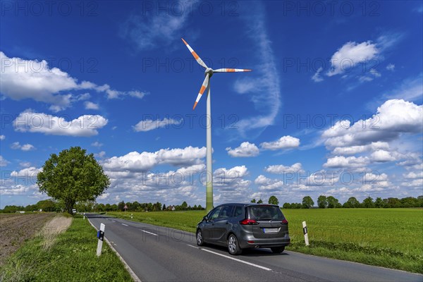 Wind turbine, wind energy plant from the manufacturer Enercon, blue sky with many white clouds,