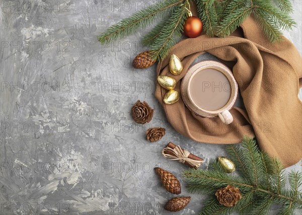 Christmas or New Year composition. Decorations, cones, cinnamon, fir and spruce branches, cup of