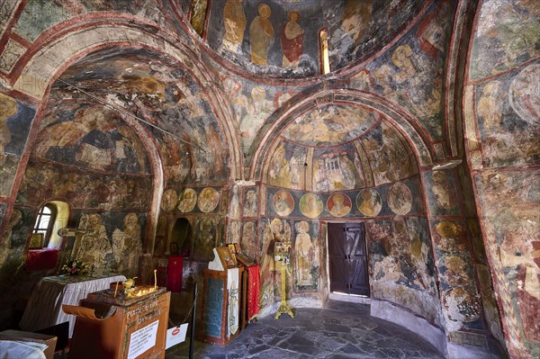 The interior of an old church with religious wall paintings, Byzantine chapel Agios Nikolaos
