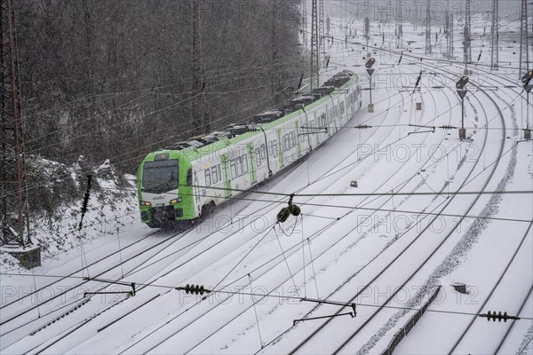 Onset of winter with lots of fresh snow and temperatures below -5 degrees during the day, railway