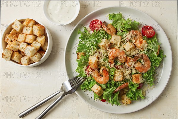 Caesar salad, with shrimp, on a white background, homemade, no people