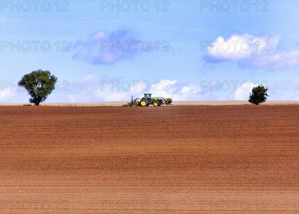 Tractor with plough in a field, Bad Frankenhausen, 13.08.2014., Bad Frankenhausen, Germany, Europe