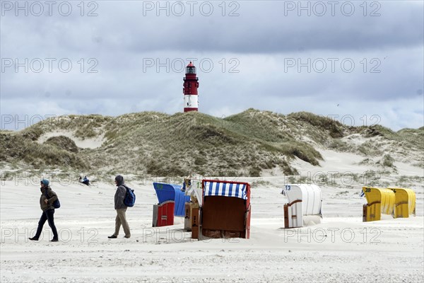 Lighthouse on the island of Amrum, beach chairs on the sandy beach, 27.05.2021