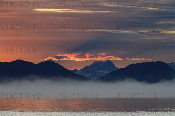 Clouds and sunset over the sea, mountain landscape, fog, Juneau, Southeast Alaska, Alaska, USA,