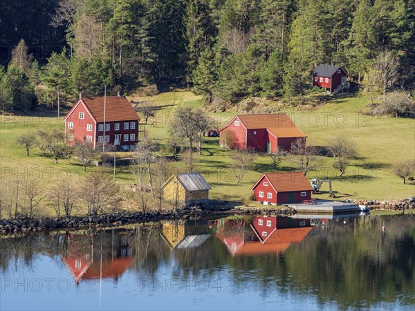 Farm with red houses on an island near Risor, norwegean southern coast, Norway, Europe