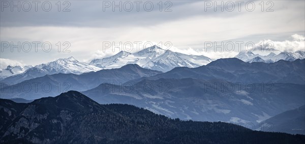 View of the Alpine foothills and the main Alpine ridge with snow-covered peaks, from the Austrian