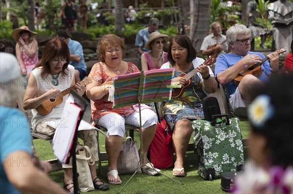 Local people singing and playing ukelele in a Waikiki event in Waikiki, Oahu, Hawaii, USA, North
