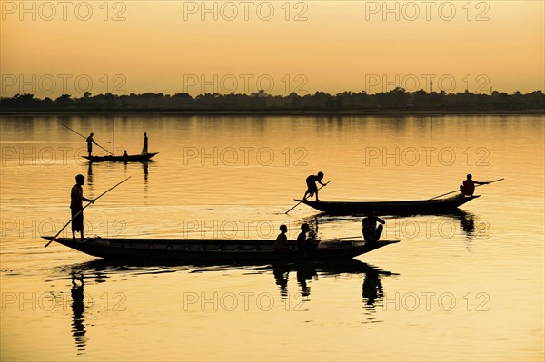 Fishermen fishing in Beki river during sunset, in Barpeta district of Assam, India on 01 Nov. 2019