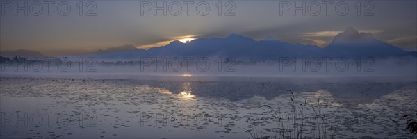Sunrise at Lake Hopfensee near Füssen, behind Hopfen am See, the Tegelberg massif and the SÃ¤uling,
