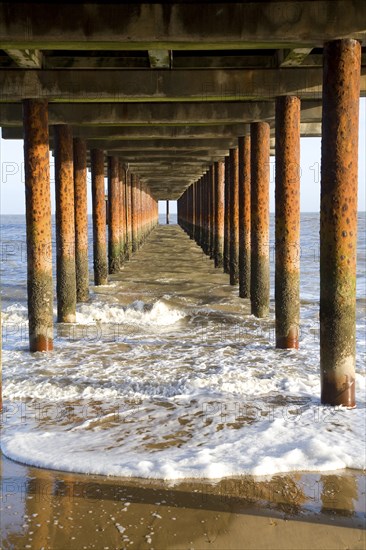 Rusty steel support pillars, Southwold pier, Southwold, Suffolk, England, United Kingdom, Europe