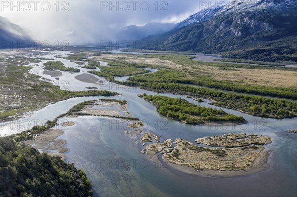 The widely branching arms of river Rio Ibanez, near Villa Cerro Castillo, aerial view, snow-capped