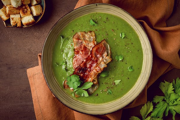 Green mashed soup, with bacon and croutons, homemade, no people