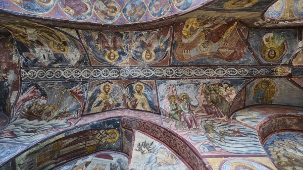Orthodox church frescoes with biblical scenes and religious icons on the ceiling, Inside the