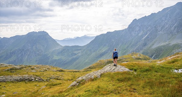 Mountaineer in front of mountain landscape, Carnic Main Ridge, Carnic High Trail, Carnic Alps,