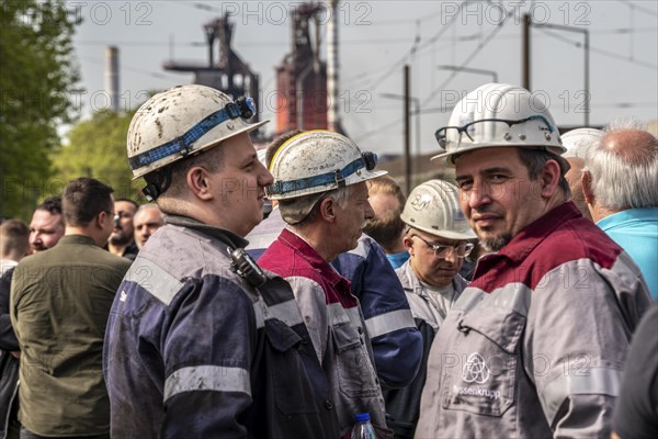 Steelworkers at a demonstration in front of the headquarters of ThyssenKrupp Steel Europe in