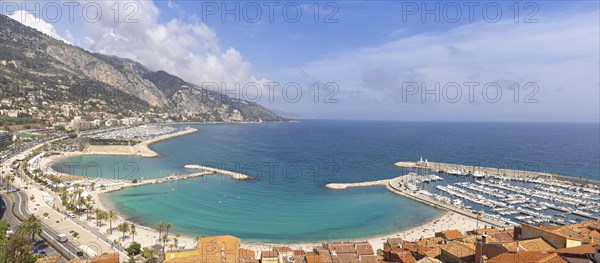Scenic panoramic view of Menton seashore promenade and historic city in French Riviera Cote D azur
