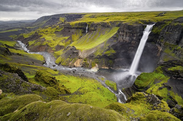 River and waterfalls at a canyon with green moss, Haifoss and Granni waterfall at a canyon, Fossa