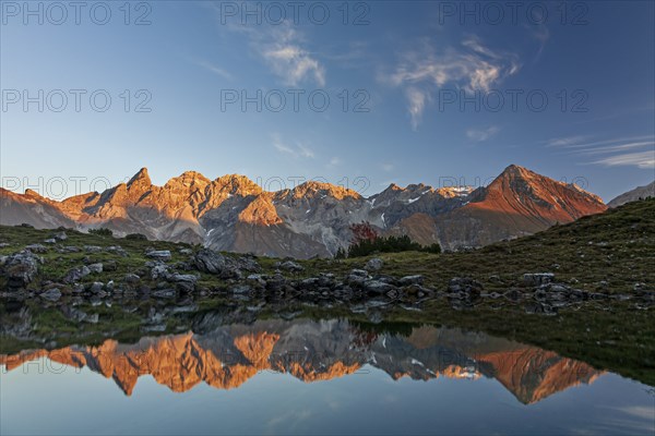 Mountains reflected in a small lake at sunset, autumn, Guggersee, AllgÃ¤u Alps, AllgÃ¤u, Germany,