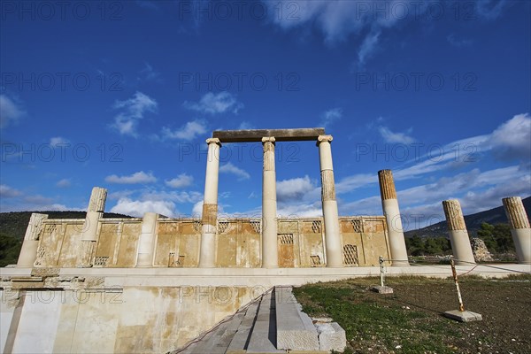 Remains of an ancient temple with majestic columns under a slightly cloudy sky, Ancient Temple,