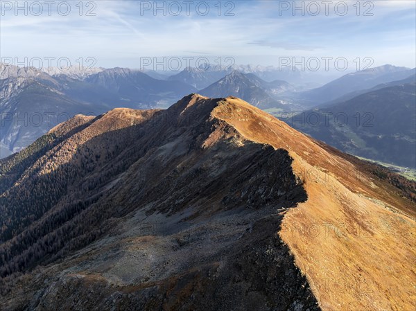 Venet mountain ridge at Kreuzjoch summit, view of Tschirgant summit and the Oberinntal valley, in