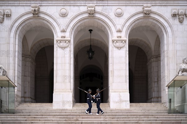 Armed guard on patrol in front of the parliament building Palacio de Sao Bento, Assembleia da