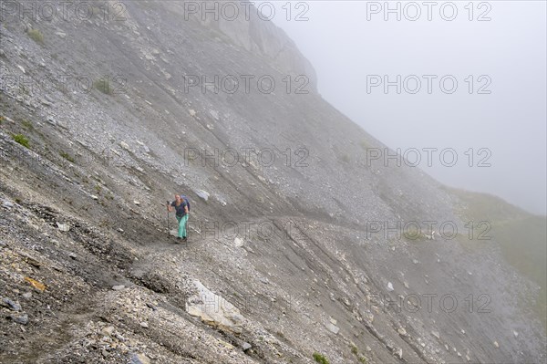 Hiker in the fog, Alpine dangers, Carnic Main Ridge, Carnic High Trail, Carnic Alps, Carinthia,