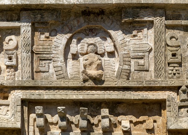Detail of elaborate decorated stone facade in Monjas complex, Chichen Itza, Mayan ruins, Yucatan,