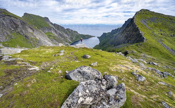Mountaineers on the hiking trail to Munkebu hut, view of the fjord Djupfjorden and mountain