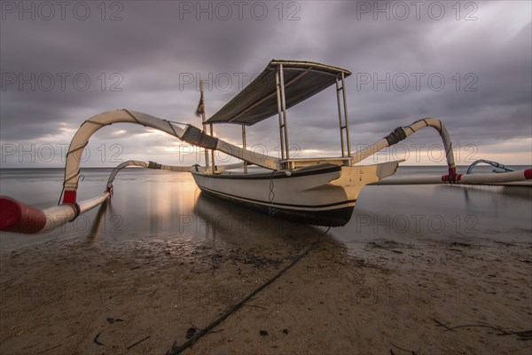Jukung in the sea, typical landscape shot with a view of the horizon over the water, taken from a