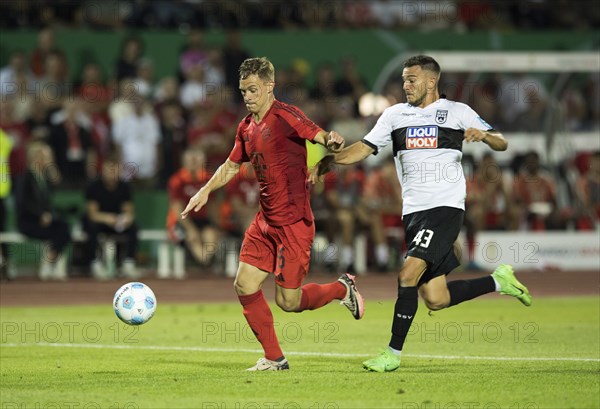 Football match, Joshua KIMMICH FC Bayern Munich left on the ball, Romario RÖSCH SSV Ulm tries to