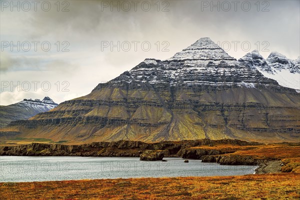 Mountain view in Stodvarfjordur on the east side of Iceland in a cloudy day