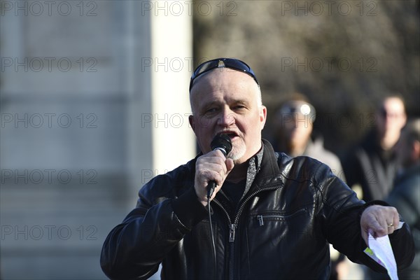 CHRISTCHURCH, NEW ZEALAND, JULY 24, 2021, A man speaks at a protest rally at the Bridge of