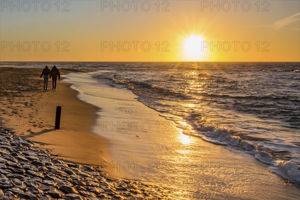 Den Helder, Netherlands. January 2022. Setting sun on the beach of Den Helder, Netherlands.