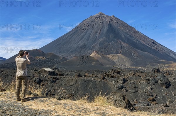 Man photographing vulcano on Fogo. Cabo Verde. Africa