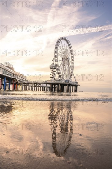 Ferris wheel on the pier on the beach at sunset, The Hague, Netherlands