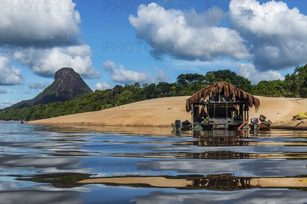Illegal gold hut on the Mavecure river, before the granite hills, Cerros de Mavecure, Eastern
