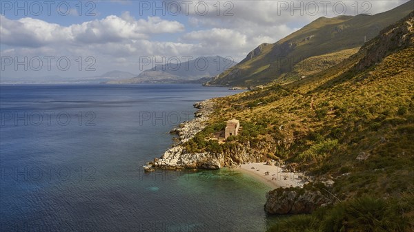 Cloudy weather, coastline, green coastal mountains, small bay, pebble beach, bathers, Zingaro,