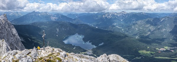 Aerial view, summit cross of the Waxenstein, Eibsee lake and Wetterstein mountains,