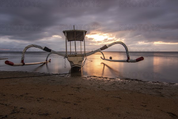 Jukung in the sea, typical landscape shot with a view of the horizon over the water, taken from a