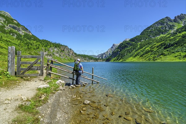 Hiker at Tappenkarsee, mountain lake, Radstätter Tauern, landscape conservation area, Kleinarl,