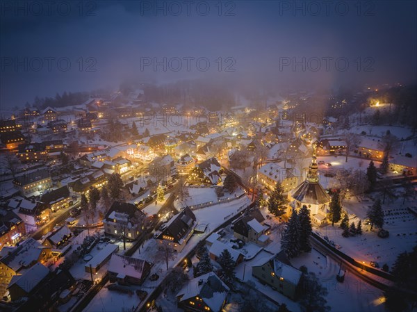 Snow-covered Seiffen with the mountain church