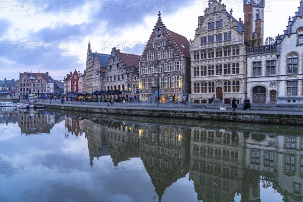Medieval guild houses of Graslei Kai on the river Leie at dusk, Ghent, Belgium, Europe