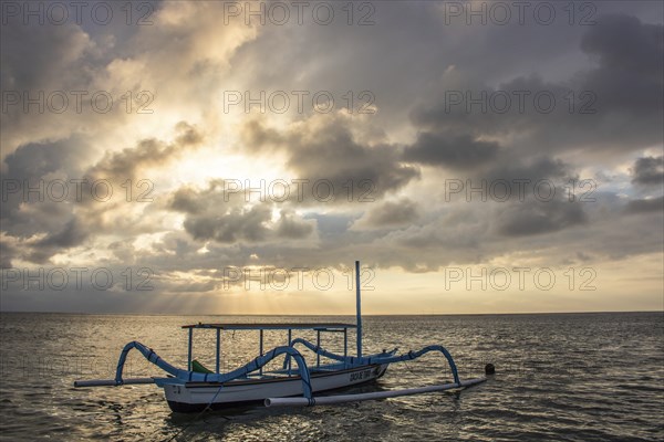 Jukung in the sea, typical landscape shot with a view of the horizon over the water, taken from a