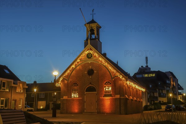 Den Helder, the Netherlands. December 2021. Kerkje van Huisduinen with Christmas lights during the