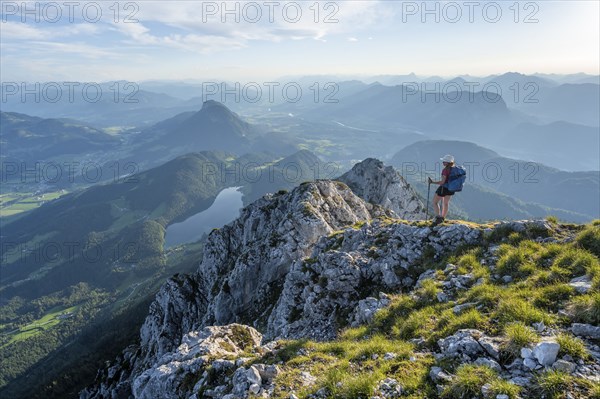 Hintersteiner Lake in the mountains, view from Schaffauer, hiker on a ridge in the mountains,