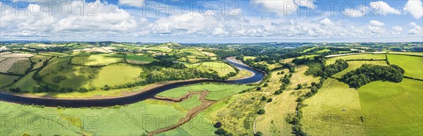 Panorama over Sharpham Meadows and Marsh over River Dart from a drone, Totnes, Devon, England,