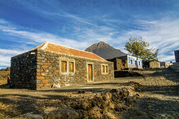 Stonehouse with vulcano in background. Fogo. Cabo Verde. Africa