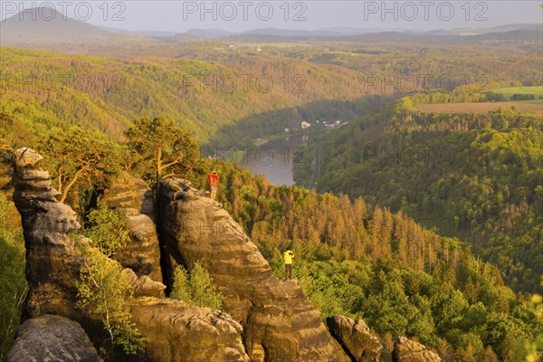 View of the Schrammstein in the Elbe Sandstone Mountains Looking upstream from the Elbe. Leisurely
